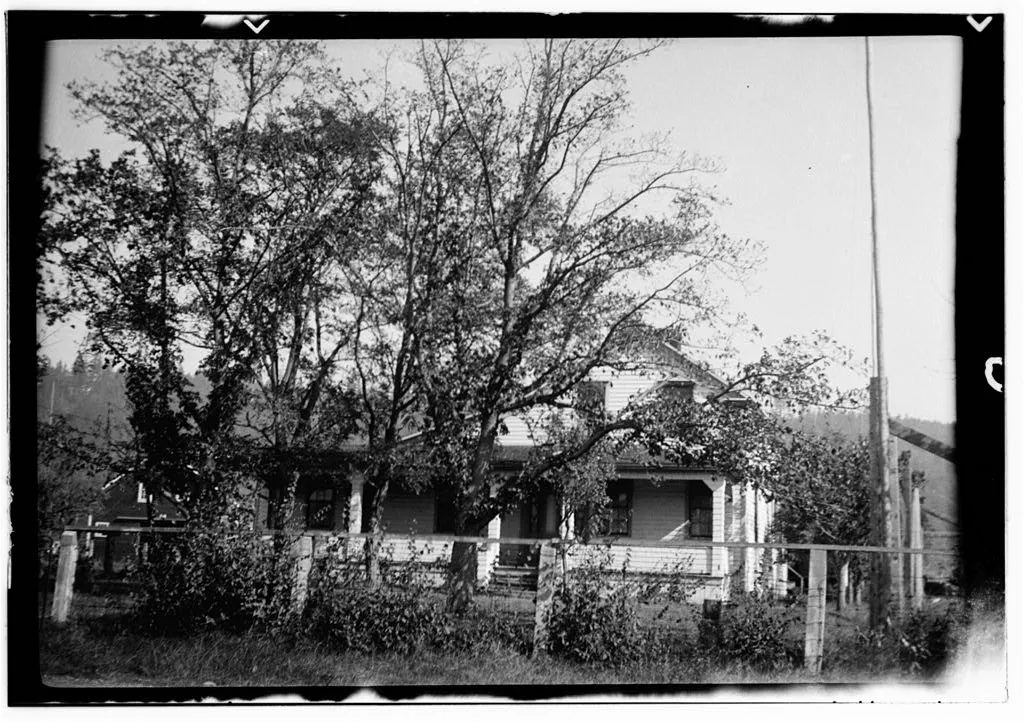 Glendale House, Chimacum, Washington — a two-storey frame farmhouse behind trees, photographed in September 1936